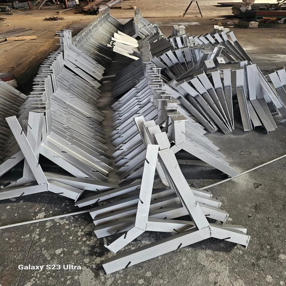 Galvanized MS angle fence posts laid out in the workshop